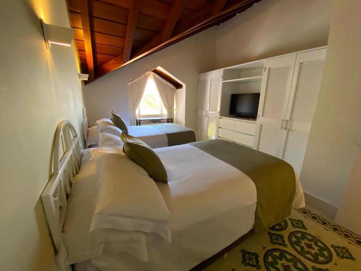 Hotel Las Americas Casa De Playa Cartagena ภายนอก รูปภาพ A room at the hotel